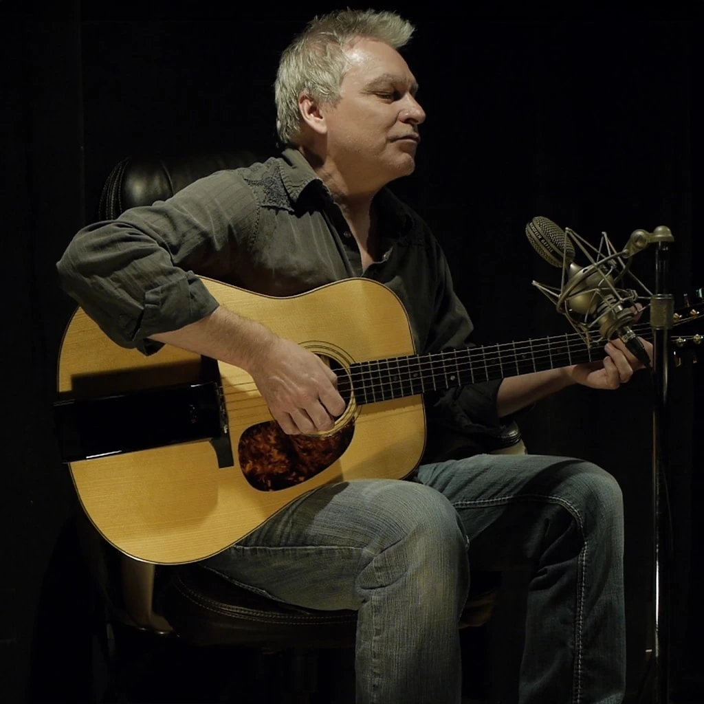 Yves Savard using the Aspri Clip-On Reverb on his acoustic guitar in the studio